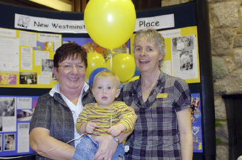 Celebrate: Marjorie Staal and Fay Duxbury, of New Westminster Family Place, with little 15-month-old Kale Arbo. Family Place is celebrating its 20th anniversary this year.